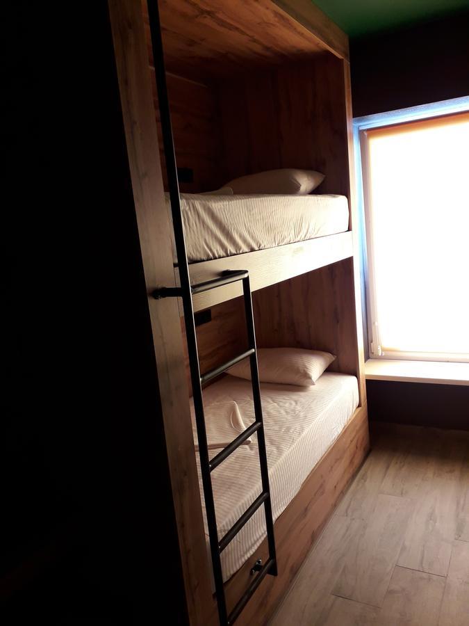 Full House Capsule Hostel Rivne Exterior photo A bunk bed with a ladder