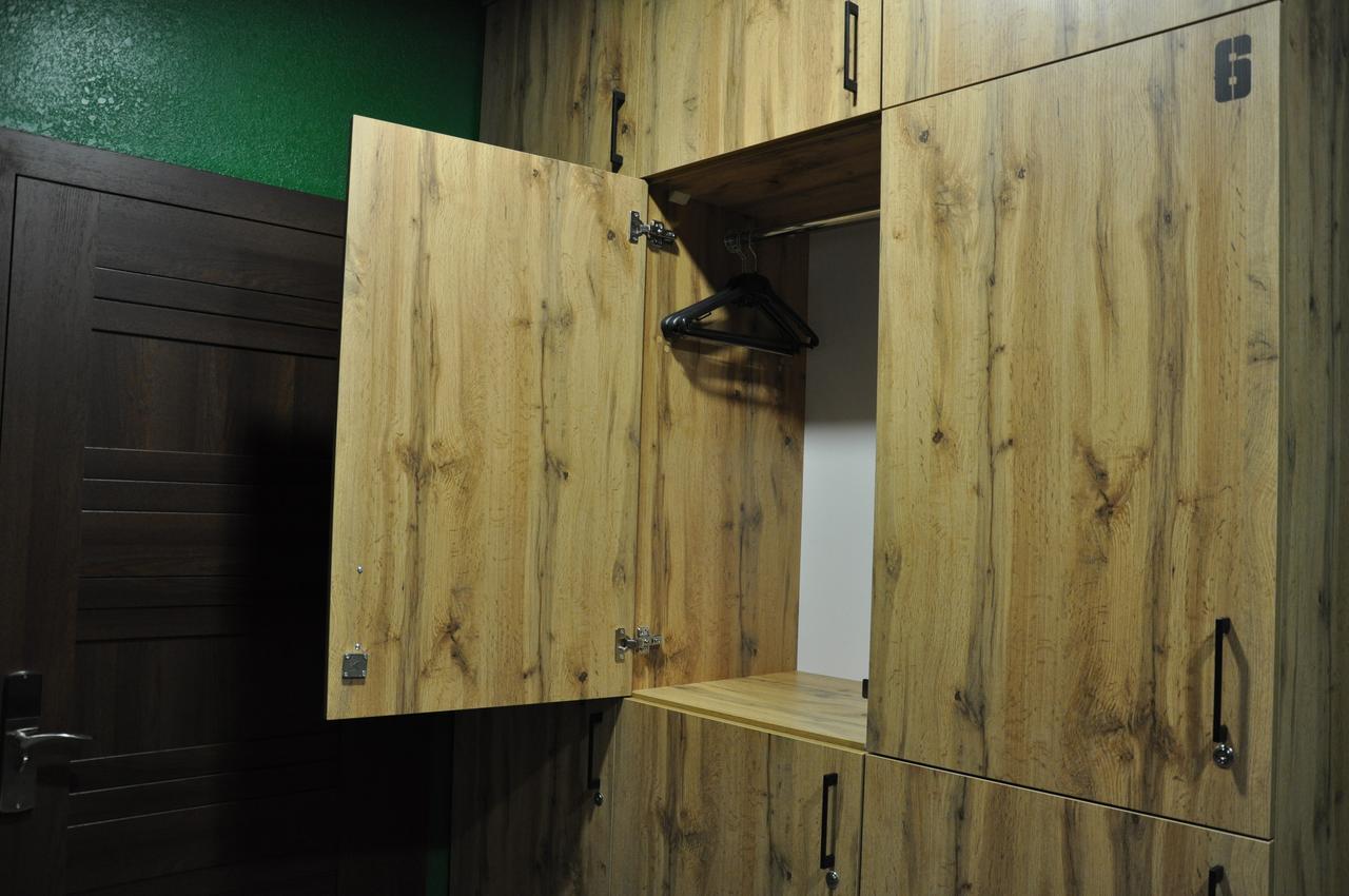 Full House Capsule Hostel Rivne Exterior photo A wooden locker
